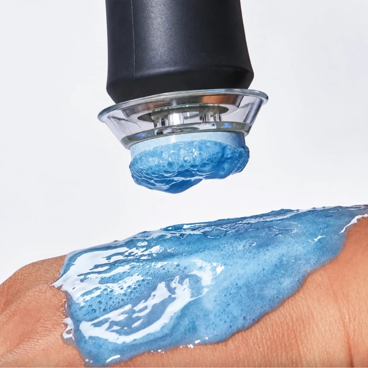 The pen pressing a blue Hydrate pod into gel