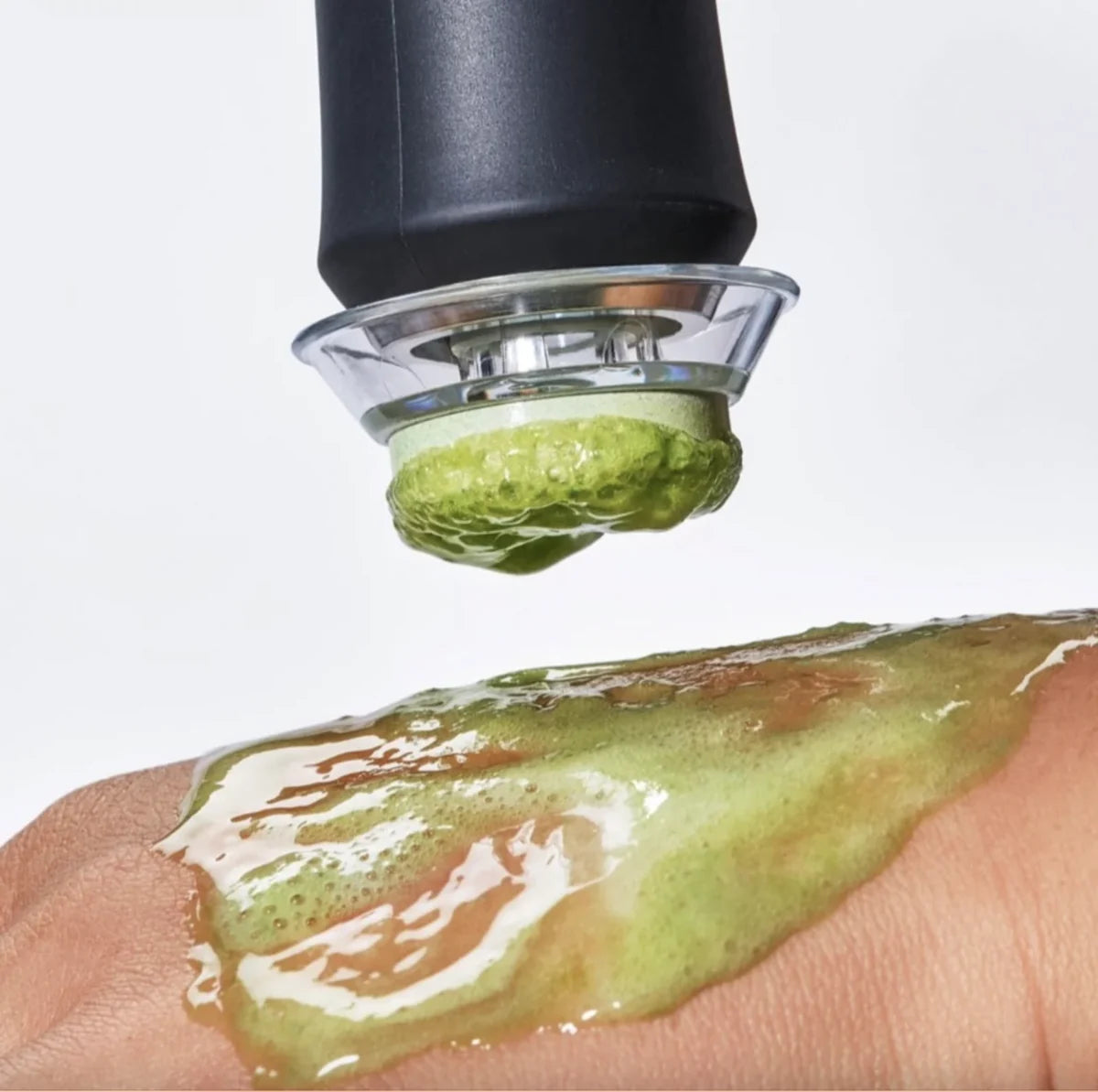 The pen pressing a green Detox pod into gel